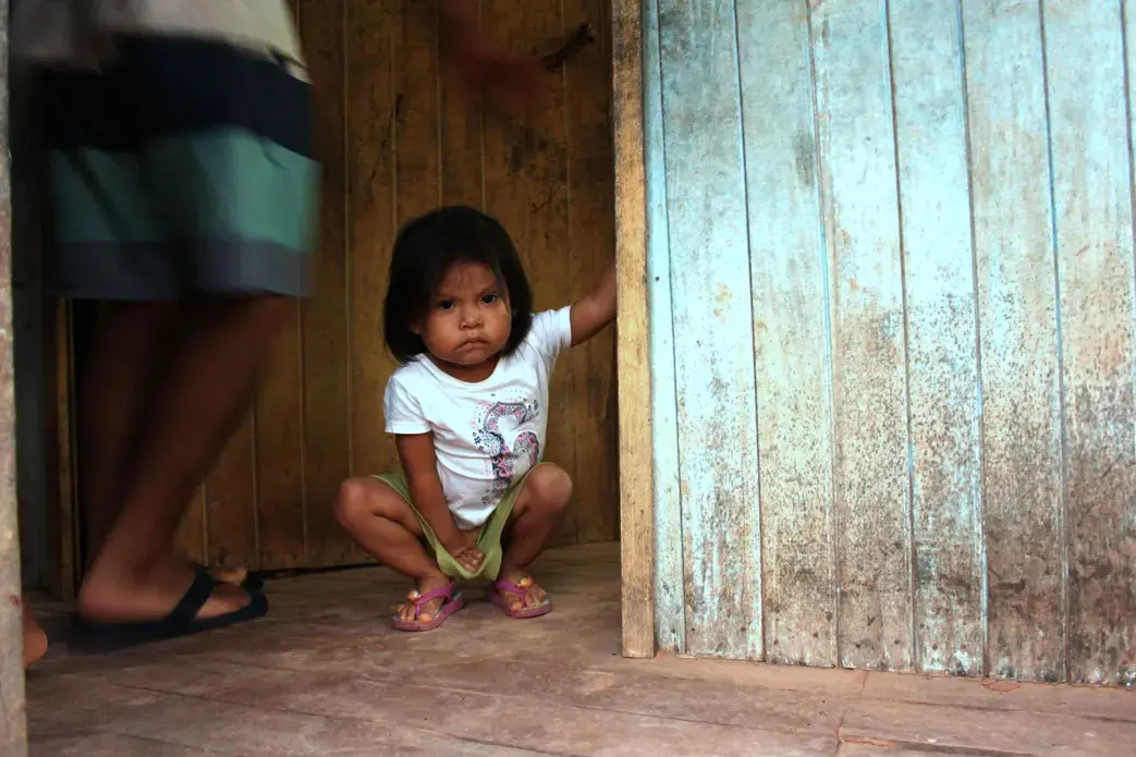 Another one of Karina's nieces, Gabriela, at the entrance to the family's kitchen in Pucallpa. Image by Natalie Hutchison. Peru, 2017.