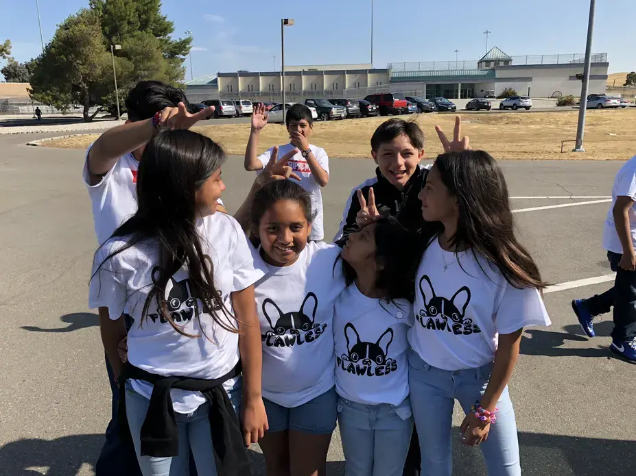 Campers pose for a photo outside the Federal Correctional Institution in Dublin, California. Image by Jaime Joyce for TIME Edge. California, 2018.