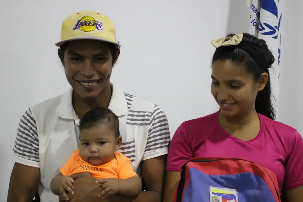 Victor with his parents, Dina Lopez and Victor Mendoza. Image by Mariana Rivas. Colombia, 2019.