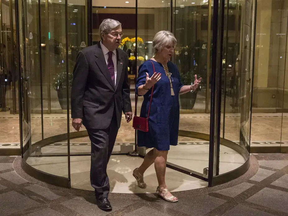 Branstad, U.S. ambassador to China and his wife Chris Branstad leave the St. Regis hotel after an Iowa Sister States reception on Wednesday, Sept. 20, 2017, in Beijing, China. They walked home to their embassy residence, only a few blocks away, after the reception. Image by Kelsey Kremer. China, 2017.