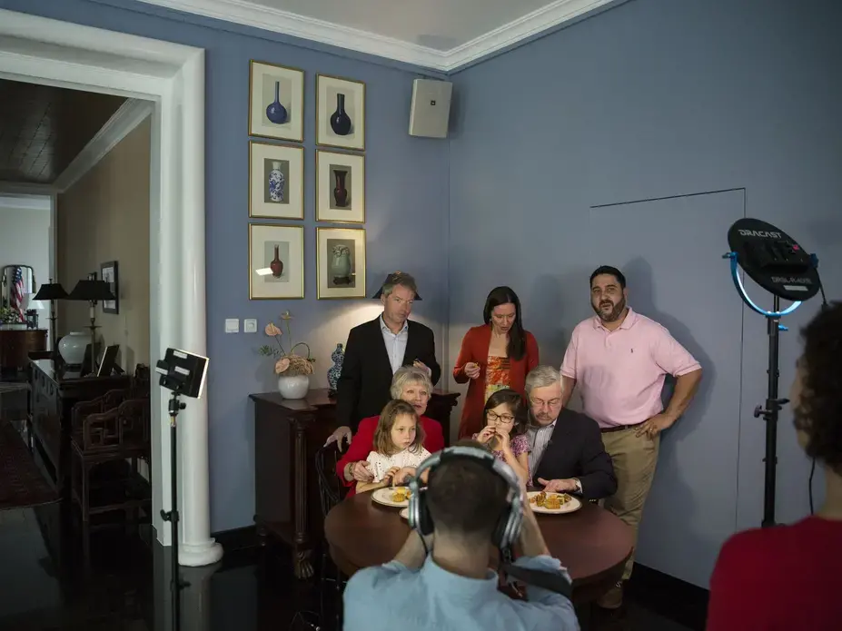 The Branstad family is filmed while eating mooncakes for a Mid-Autumn Festival video greeting filmed by members of the U.S. Embassy staff Sunday, Sept. 24, 2017, at the ambassador's residence in Beijing, China. Mooncakes are traditionally eaten to celebrate the holiday, which fell on Oct. 4 this year. Image by Kelsey Kremer. China, 2017.