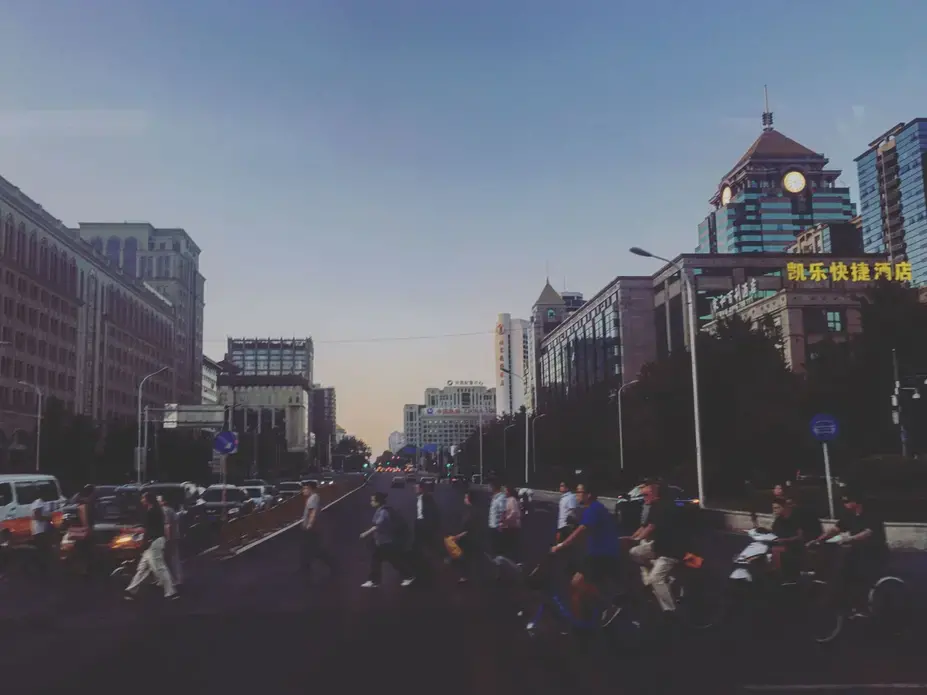 The sun sets during evening rush hour in China's capital city, Beijing, on Tuesday, Sept. 19, 2017. Image by Kelsey Kremer. China, 2017.