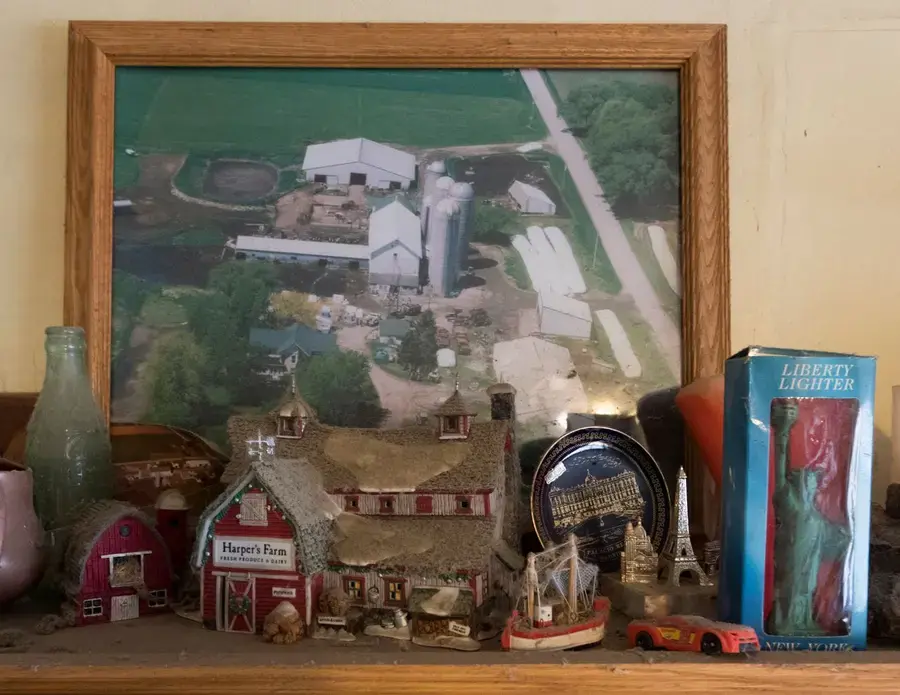 Mementos surround a photo of the Mess family farm in the kitchen. Image by Mark Hoffman. United States, 2019.
