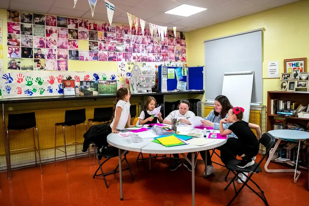 Children make vision boards during a Young People's Futures arts and crafts session at Possilpoint Community Centre. Image by Michael Santiago. United Kingdom, 2019.