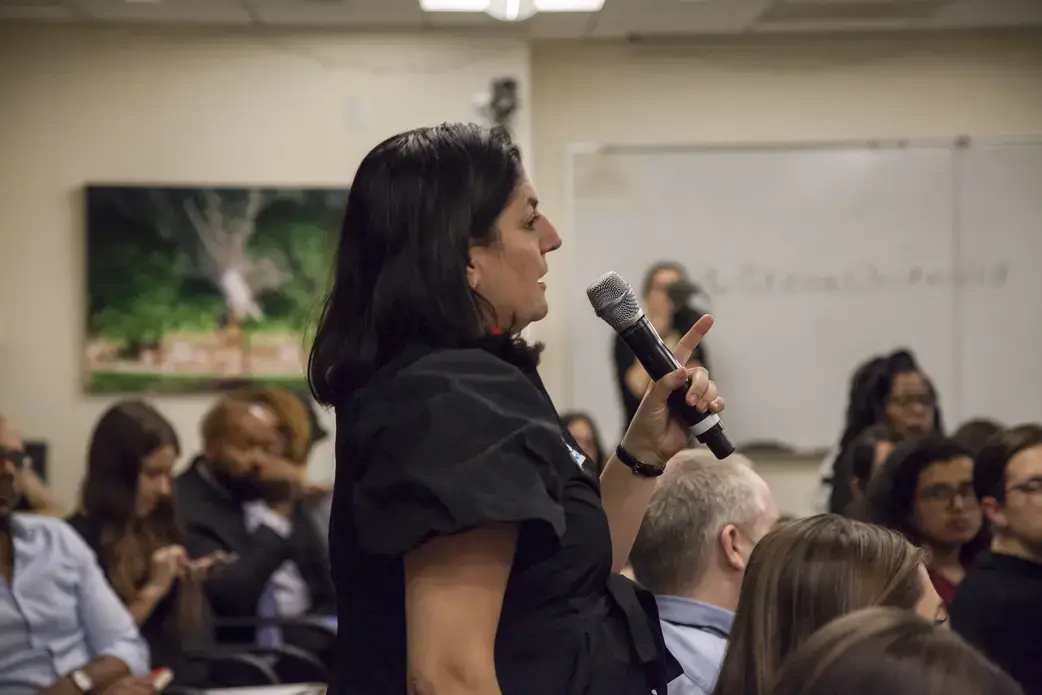 Pulitzer Center executive editor Indira Lakshmanan poses a question to the global health panel. Image by Jin Ding. United States, 2018.