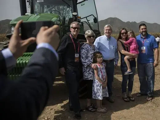 Ambassador Terry Branstad and his family pose for a photo on the China-US Demonstration Farm. Image by Kelsey Kremer. China, 2017.