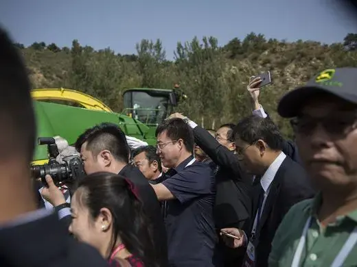 People gather to get a photo of the Branstad family during the groundbreaking of the China-US Demonstration Farm on Saturday, Sept. 23, 2017, in Luanping County, Hebei, China. Image by Kelsey Kremer. China, 2017.