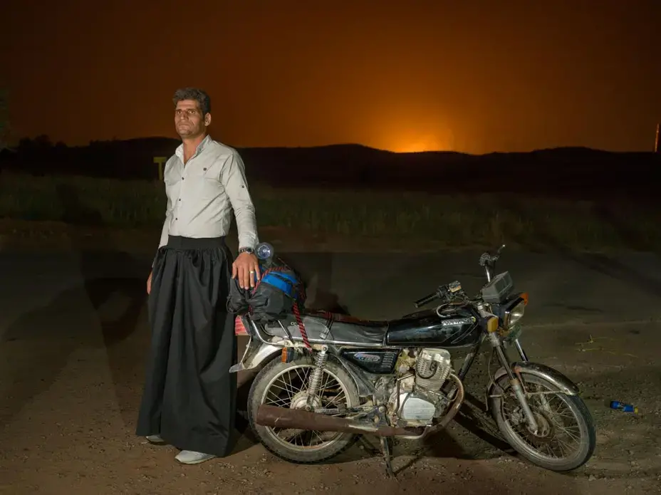 Ebrahim Rostami, 45, is a native of Najafabad, Isfahan Province. He has a one-year-old daughter and says living as a nomad is getting harder: “I can’t see anything positive in it anymore. I’m going to sell my flock next year and look for a job in the city because of my daughter’s future.” Image by Newsha Tavakolian. Iran, 2018.