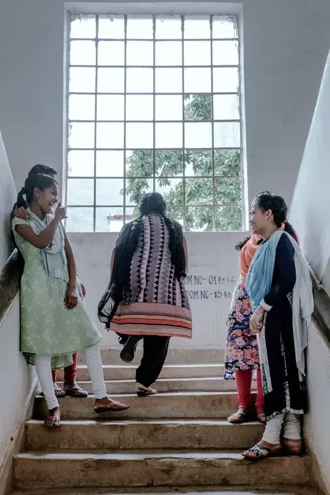 A moment with friends inside the girls' hostel where Purnima lives. Image by Arko Datto. India, 2018.