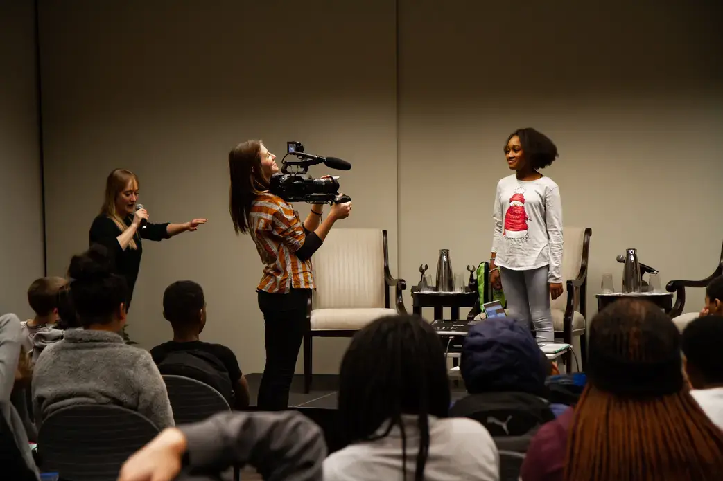 A volunteer student helps the filmmakers demonstrate a scene breakdown. Image by Claire Seaton. Washington, D.C., 2018.