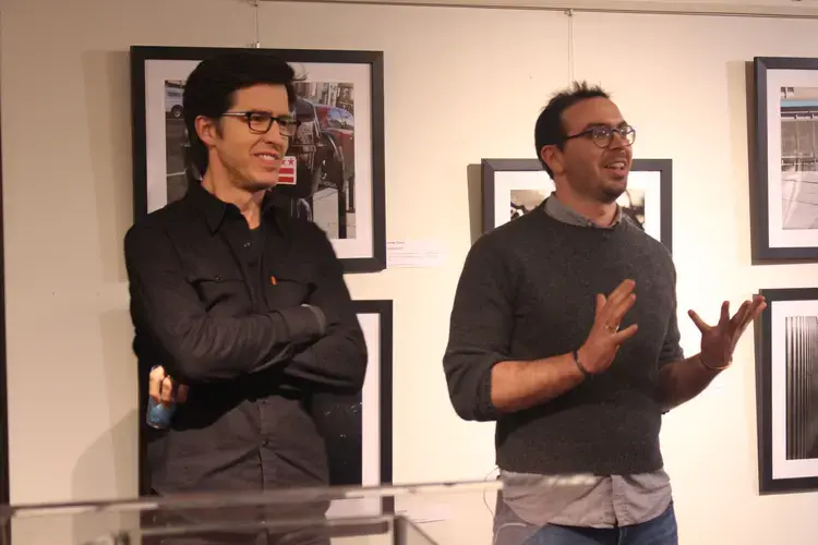 Peter DiCampo and Austin Merrill speaking at the EverydayDC exhibit opening. Image by Kayla Sharpe. United States, 2018.