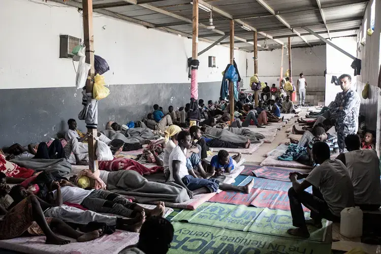 West African migrants rest in the Abu Salim detention center. Image by Peter Tinti. Libya, 2017.