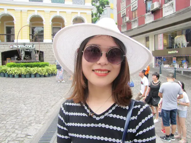 Emma Chen, a self-titled 'Portuguese-enthusiast,' during one of her frequent visits to the Ruins of St. Paul's, in the historic center of Macau. Image by Bruno Beidacki. Macau, 2017.