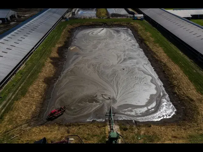 A manure pond at Chris Weaver's Bridgewater Dairy near Montpelier, Ohio, on Sept. 23, 2019. Weaver raises about 3,000 dairy cows at that location and uses liquid cow manure to fertilize his fields nearby. Image by Zbigniew Bzdak / Chicago Tribune. United States, 2019.