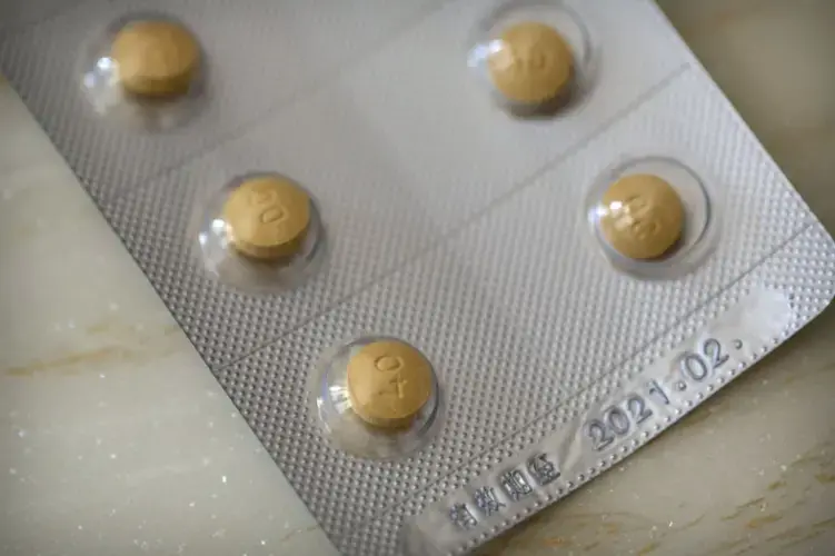 This Sept. 24, 2019 photo shows 40-milligram Oxycontin tablets sold in China in Hunan province. China fought two wars in the 19th century to beat back British ships dumping opium that fueled widespread addiction. Today, the cultural aversion to taking drugs, in Chinese, literally 'sucking poison', is so strong addicts can be forced into police-run treatment centers. Image by Mark Schiefelbein / AP Photo. China, 2019.