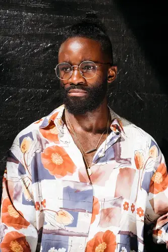 German fashion stylist Cedric, 29, planned on bringing home his experience at Afropunk Fest Paris 2017. 'I'm so proud of my color and now I am more proud. I am sad it is finished, but every good thing finishes. Now we are going to do this in Germany.' Image by Melissa Bunni Elian. South Africa, 2017.