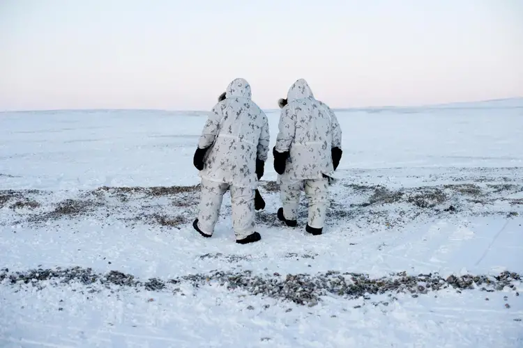 “Keep moving” is a key principle in Arctic military operations, when anything—or anyone—standing still long in subzero temperatures risks freezing in place. Here, Canadian Captain Wayne LeBlanc and Master Corporal Jeff Valentiate walk north on Cornwallis Island. Image by Louie Palu. Canada, 2018.