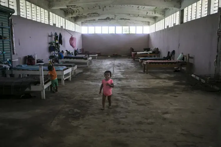 The Todo por Ellos ('all for them') shelter gives migrants a rag-tag refuge in a Mexican government building next to a Tapachula dump. Image by Jose Cabezas. Mexico, 2018. 