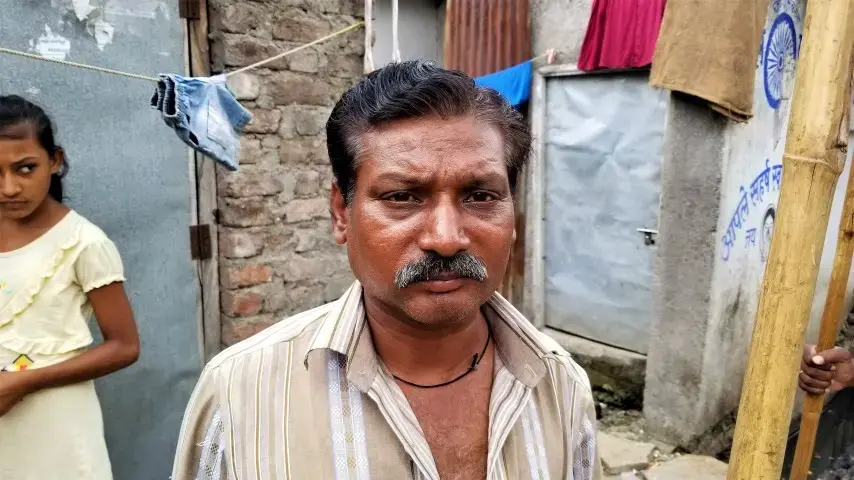Dalit sewage cleaner, who is on the lowest rungs of so-called 'untouchables.' Image by Phillip Martin/WGBH News. India, 2019.