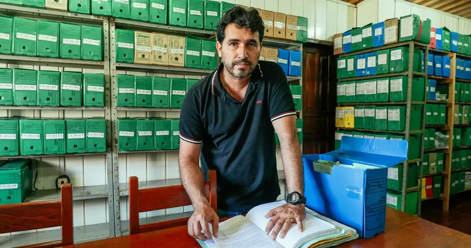 The office of Environmental protection officer Evandro Carlos Selva in Humaitá, Brazil is stuffed with boxes full of fines for illegal logging, most of which, he says, were never paid. Image by Sam Eaton. Brazil, 2018.