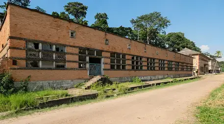 Many of the buildings at the research site in Yangambi, DRC, are vacant, and today the facility runs on a fraction of the budget it had last century, with a very small Congolese staff working to preserve what it can from the past and researching methods for improving farming and forestry. Image courtesy of Axel Fassio/CIFOR. Democratic Republic of the Congo.