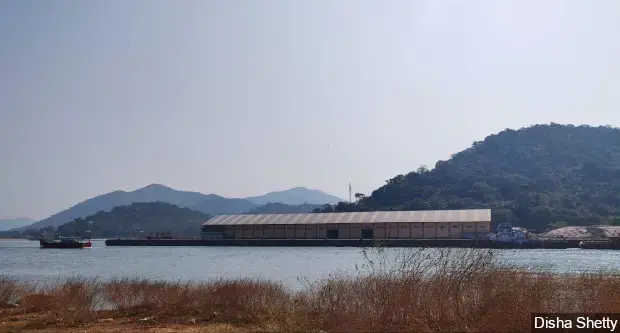 The Karwar port (pictured above) is at the southern end of the narrow beach. Apart from a new cargo terminal, new structures such as breakwaters on the beach and the expansion of roads leading to the port, are proposed to be built. These could severely disturb fishing activity in the area. Image by Disha Shetty / IndiaSpend. India, 2020.