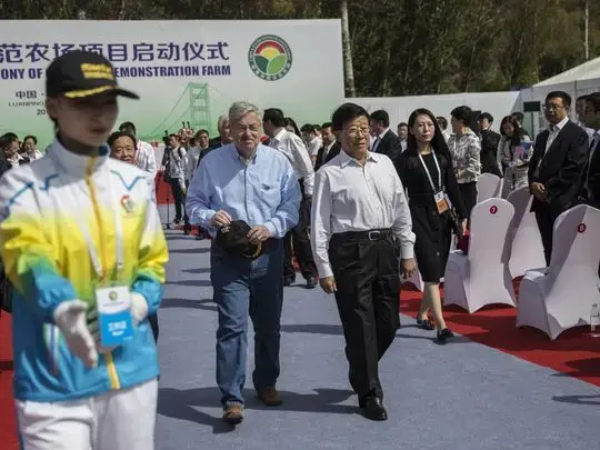 Ambassador Terry Branstad and Hebei Party Secretary Zhao Kezhi walk together through the groundbreaking ceremony for the China-US Demonstration Farm on Saturday, Sept. 23, 2017, in Luanping County, Hebei, China. Image by Kelsey Kremer. China, 2017.