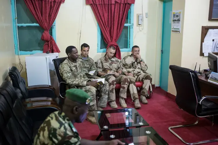 American and French soldiers attend a daily briefing with the Nigerien military commander in charge <br />
of the fight against Boko Haram at a Nigerien military base in Diffa, Niger. Image by Joe Penney. Niger, 2018.