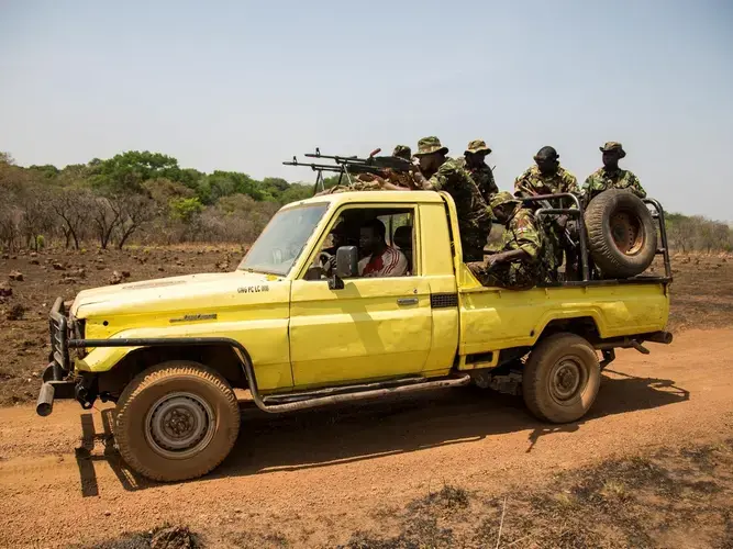 Rangers head back to base from the shooting range. In the words of Stefan Maritz, a South African and Chinko’s acting assistant law enforcement manager: 'Our mission is to fight the wrong. In Chinko, there is authority. There are consequences...Once accountability falls away, nothing works anymore.” Image by Jack Losh. Central African Republic, 2018.