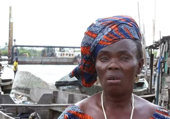 Christiana Gbetode laments the impact of dredging on the fish trade in Bishop Kodji Island. Image by Bukola Adebayo. Nigeria, 2017.<br />
