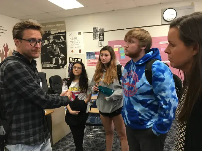 Carl Gierstorfer speaks with students and teacher Kristen Collins at Parkway West High School in St. Louis