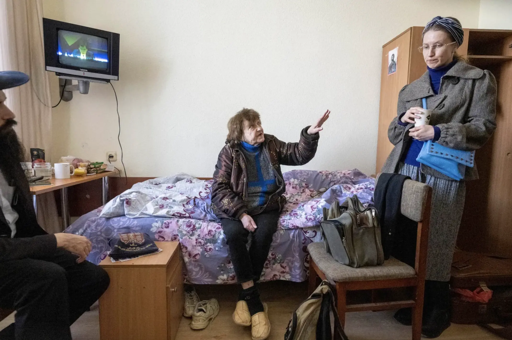 Tatiana Larina 73, of Mykolaiv, Ukraine tells Olena Khorenjenko right, about her journey to a refugee housing at Bukoria Pension in Vodola-Veda holiday suburb.