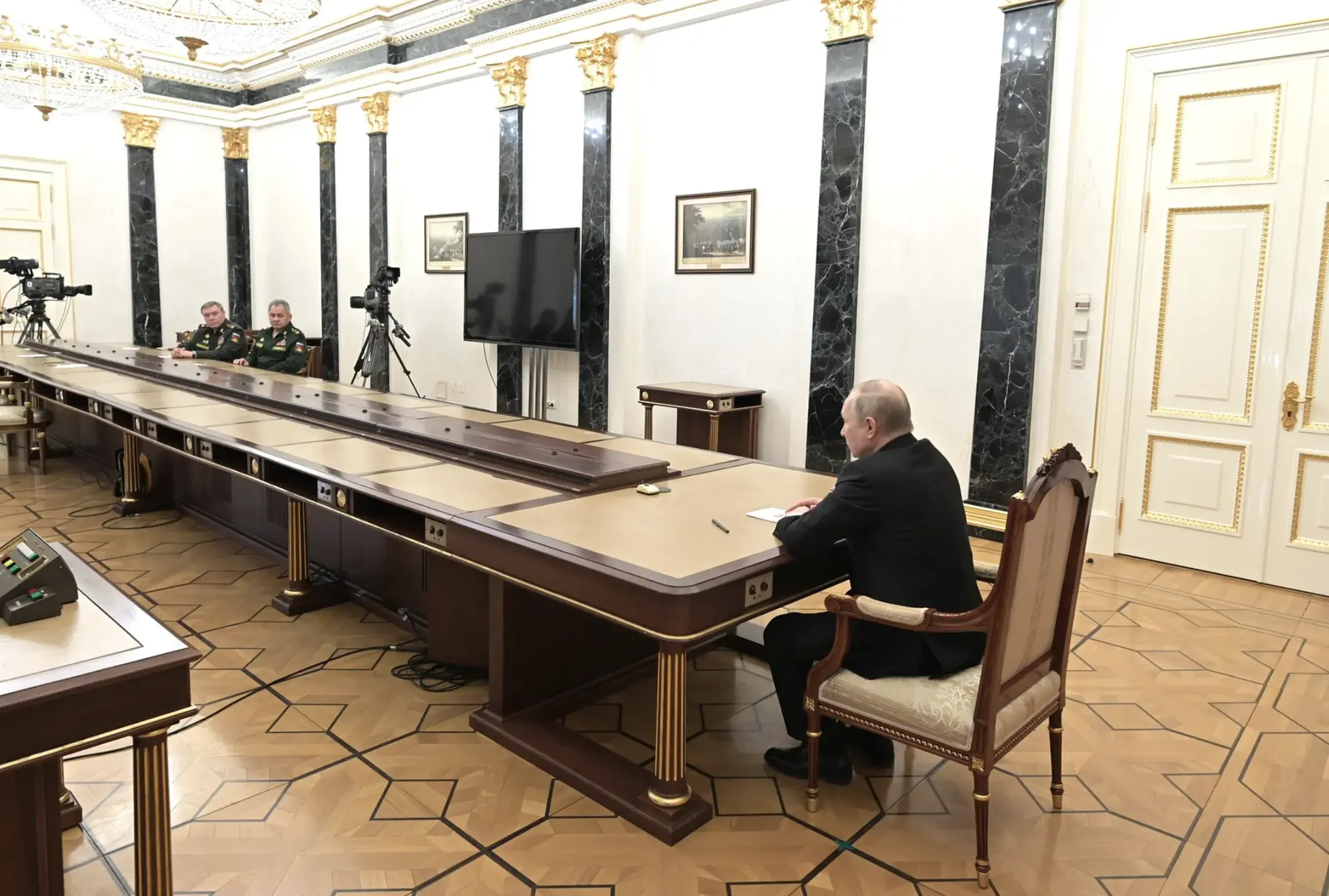 Putin sits at table