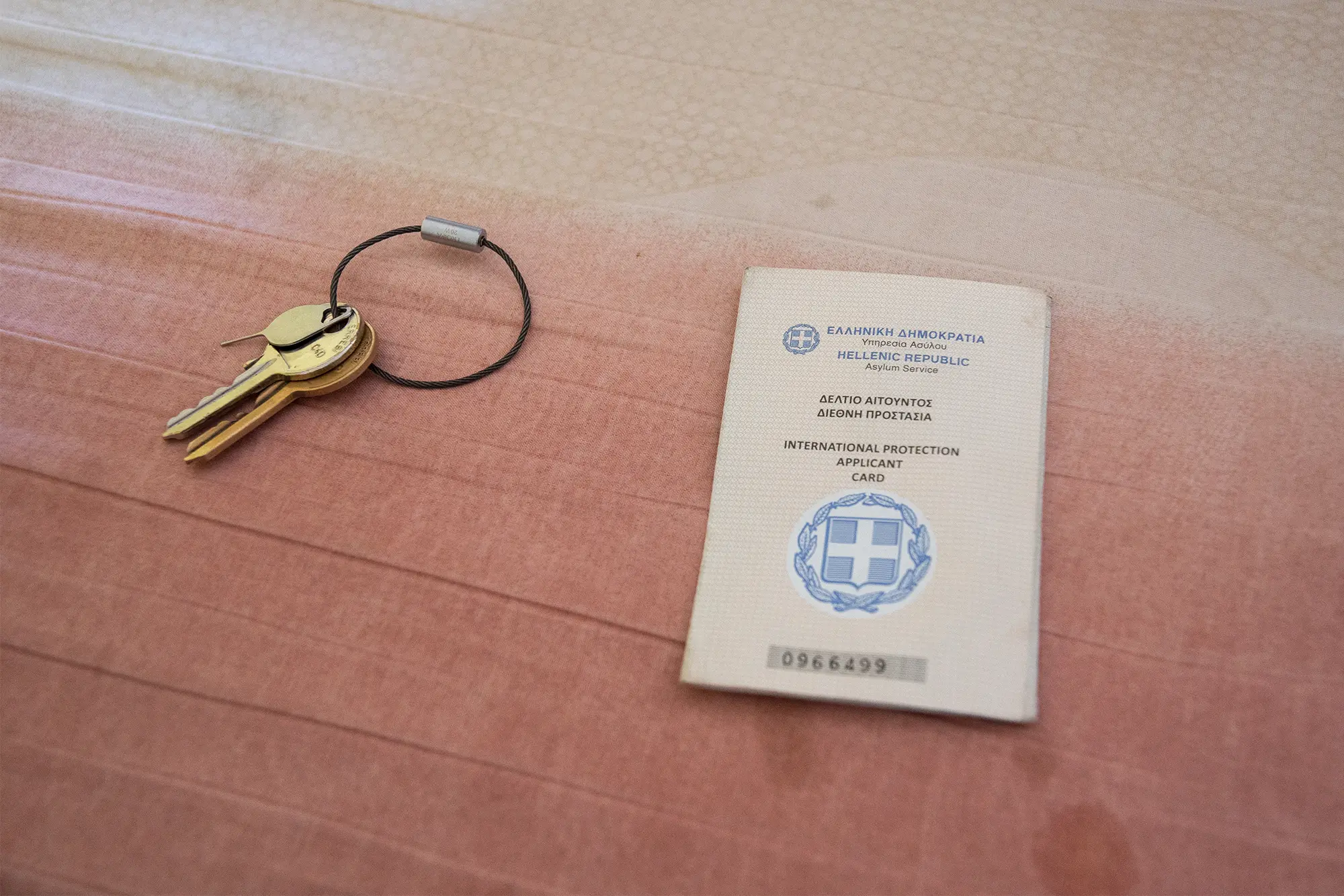 An asylum card with a house key