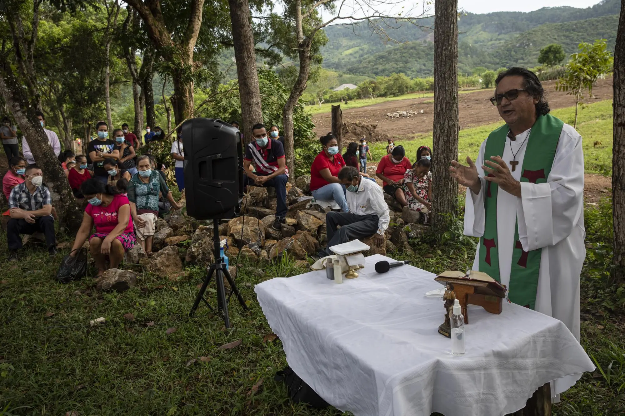 Priest speaks at outdoor mass
