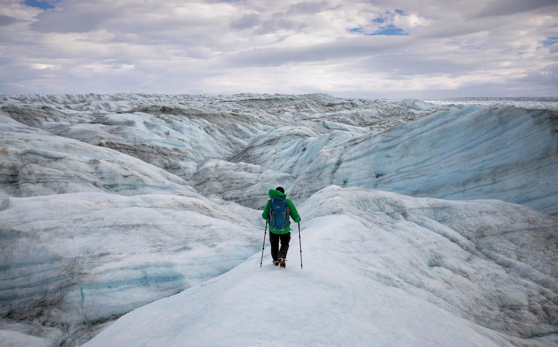 A man manuvers Greenland ice sheet