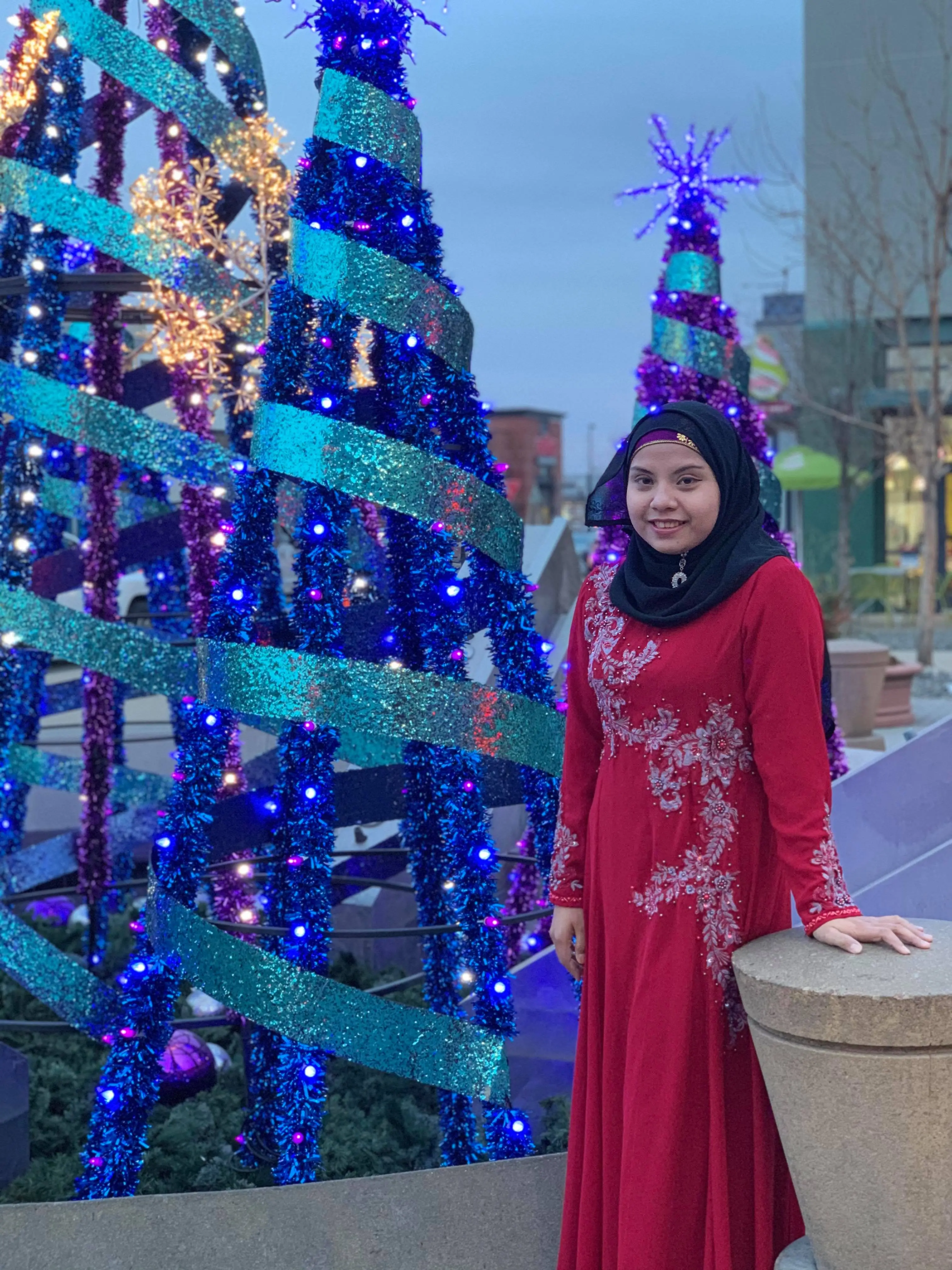 Shamsul poses with holiday decorations outside