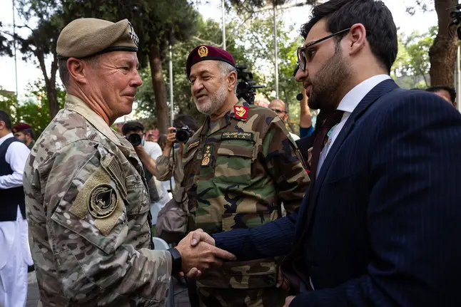 U.S. Military general shakes hand with Afghan official
