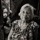 Felicidad delos Reyes, 90, died of pneumonia on Feb. 1, 2020. Here, she was photographed with her great-grandchildren on the family property in Antipolo, outside Manila, in the Philippines. As a student in Masbate during the Japanese occupation of World War II, delos Reyes was asked to sing with her class for visiting Japanese soldiers — with dire consequences. Image by Cheryl Diaz Meyer. Philippines, 2019.