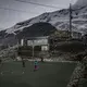 Men play soccer on artificial turf. Grass does not grow at 17,700 feet. Peru, 2019. Image by James Whitlow Delano.