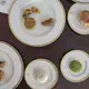 Mooncake pieces and crumbs are left behind after the Branstad family tried the sweets for a Mid-Autumn Festival video filmed by members of the U.S. Embassy staff on Sunday, Sept. 24, 2017, at the ambassador's residence in Beijing. Mooncakes are traditionally eaten to celebrate the holiday, which fell on Oct. 4 this year. Image by Kelsey Kremer. China, 2017.