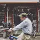 A man rides his bike past a hardware store on Sunday morning, Oct. 1, 2017, in Shanghai. Image by Kelsey Kremer. China, 2017.