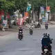 Morning rush hour in the small city of Thai Hoa, Vietnam, about 150 miles south of Hanoi. Image by Mark Hoffman. Vietnam, 2019. 
