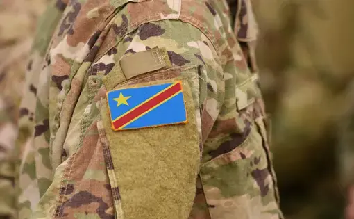 Democratic Republic of the Congo flag on soldiers arm. Democratic Republic of the Congo troops