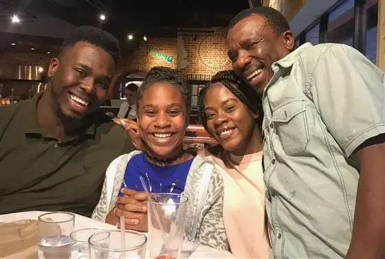 Errol Wray Jr. (left) with his two younger sisters and his dad Errol Wray Sr. during a family night out in New York City. Courtesy Errol Wray Jr.<br />
