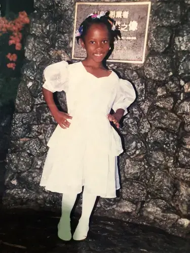 Monique Campbell at her kindergarten graduation in Jamaica. She made the short film Missing Melodie about migrating to the U.S. and the difficulty in her family reunion not being what she expected. Courtesy Monique Campbell.<br />
