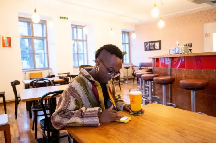 After finishing work at 'Queer Base' in Vienna, Faris has a beer in the queer friendly<br />
space Villa Vida in central Vienna, Austria's capital. Image by Bradley Secker. Austria, 2020.