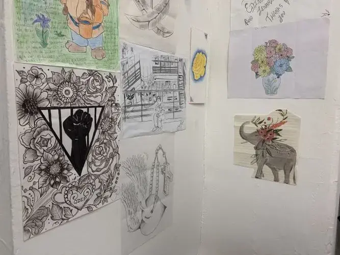 Drawings featured on one of the walls of the Queer Detainee Empowerment Project’s office. Several were created by detainees and sent to the organization from detention centers. Image by Adithi Ramakrishnan. United States, 2020.