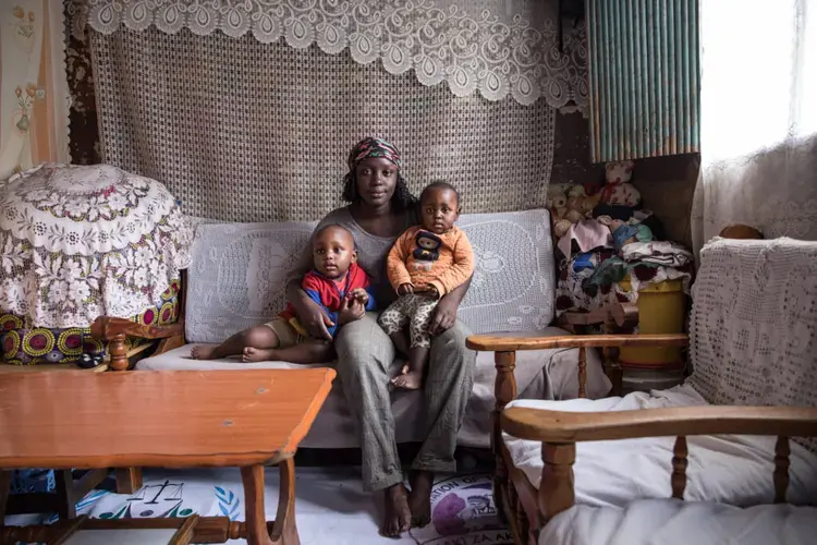Winnie in her home with her children Reggie (2) and Rhian (1). Image by Sarah Waiswa/The Everyday Projects. Kenya, 2020.</p>
<p>