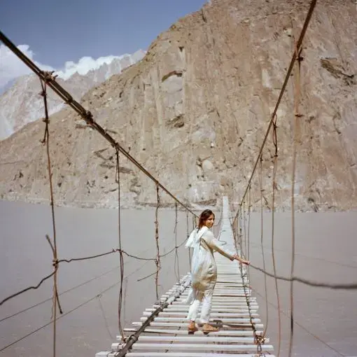 British visitor Subeera Hussain walks along a hanging bridge near Passu, a town in the Hunza valley of northern Pakistan. She wishes more people knew about the country's beauty. 